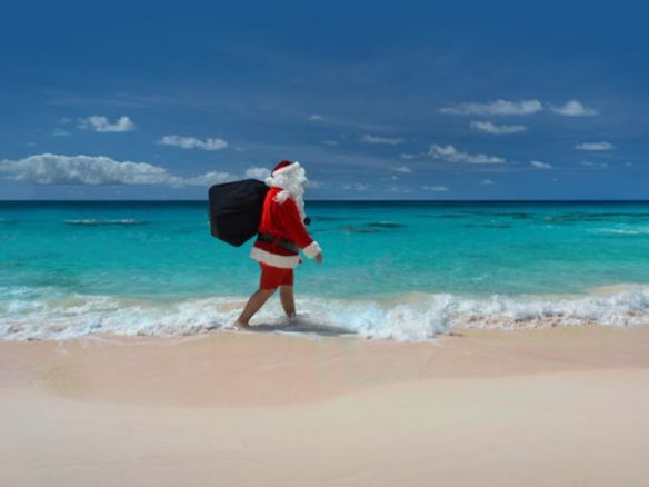 635853563813200149-bermuda-santa-in-shorts-on-the-beach-credit-hamilton-princess-bermuda